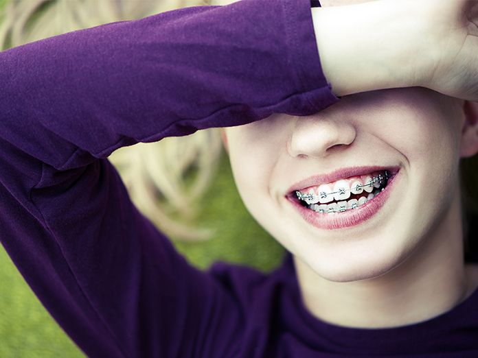Girl with braces smiling